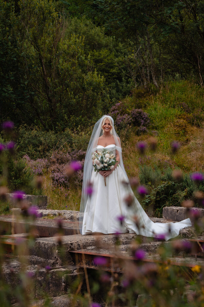 bride poses in wedding dress at an Irish wedding