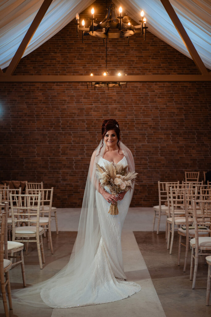 bride poses in wedding dress at an Irish wedding