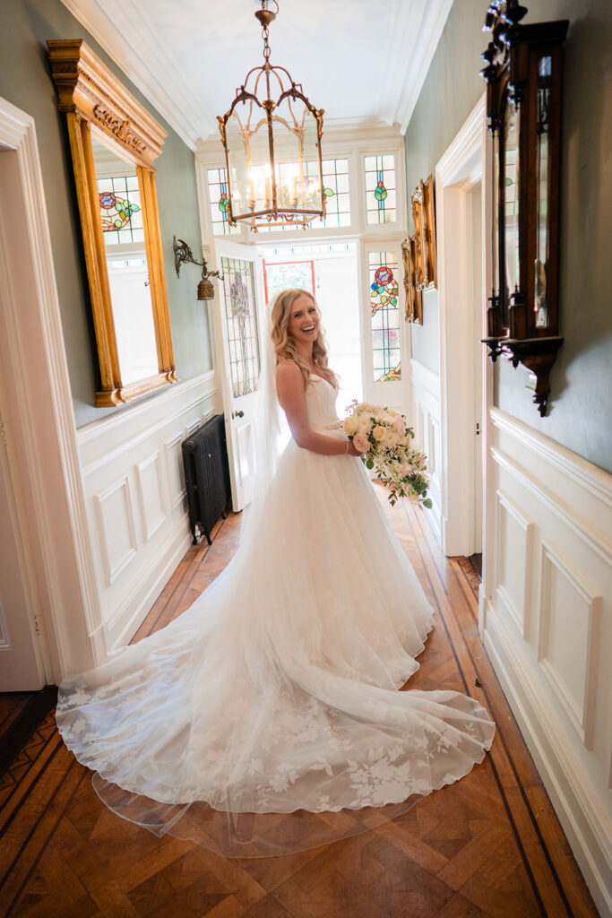 bride poses in wedding dress at an Irish wedding